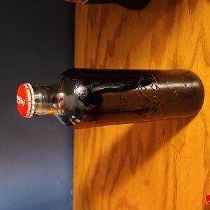 Coca Cola Classic bottle full.  7.27 FL oz